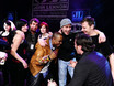 ﻿Jurymitglied Cloy Petersen nach der Bekanntgaber der Siegerband 'Taxgas' auf der Bühne des John Lennon Talent Award in der Muffathalle München mit Band 'Kellerchaos' am 28.3.2009.
